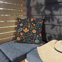 Thumbnail for Decorative floral pillow on a gray cushioned bench with a straw hat nearby.