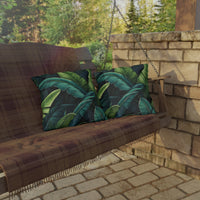 Thumbnail for Wooden swing with green leaf-patterned cushions on a stone patio