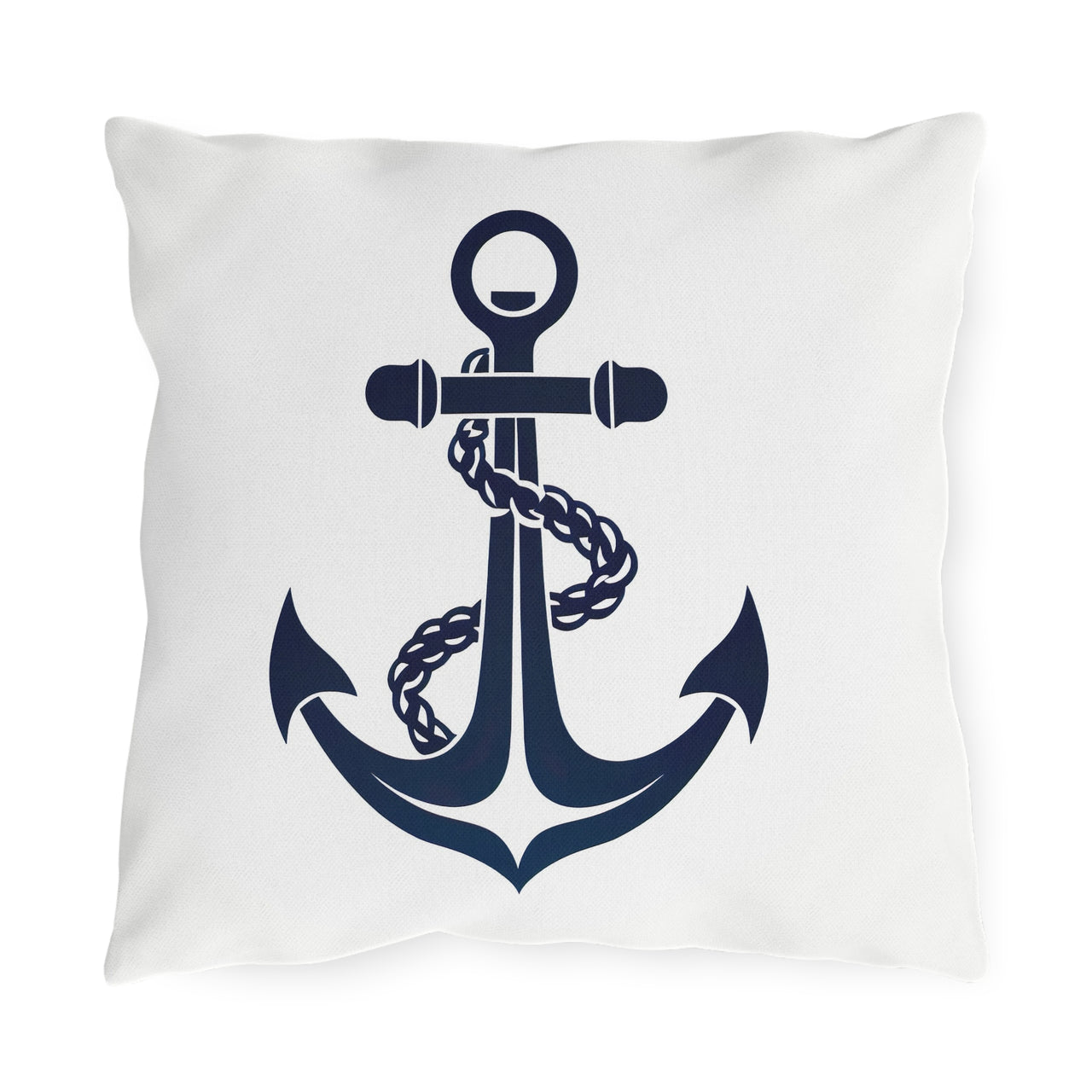 White pillow with a navy blue anchor design on a white background