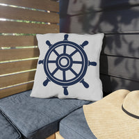 Thumbnail for Pillow with a ship's wheel design on a wooden bench